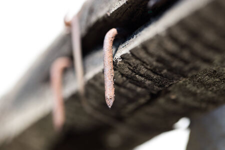 rusty nail in a board. Macroの写真素材