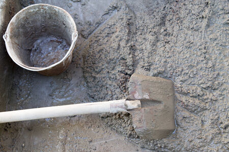 cement solution with a shovelの写真素材