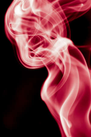 red smoke on black backgroundの写真素材