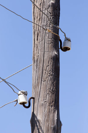 wooden pole with electricityの写真素材