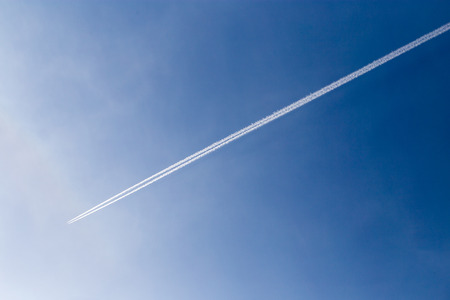 trace of the aircraft in the blue sky