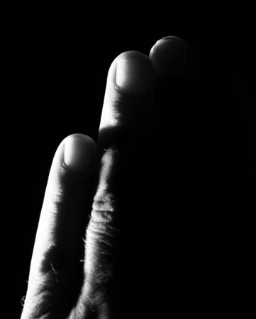 hand on a black backgroundの写真素材