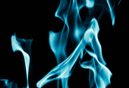 abstract background of blue flame fire on black backgroundの写真素材