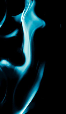 abstract background of blue flame fire on black backgroundの写真素材