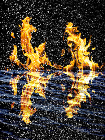 snow on the fire background with reflection on waterの写真素材