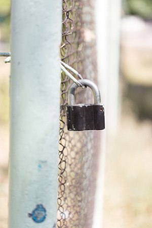 metal lock on the fenceの写真素材