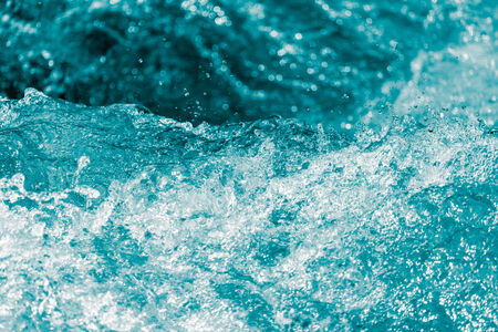 background of stormy water with splashes