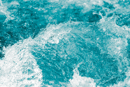 background of stormy water with splashes