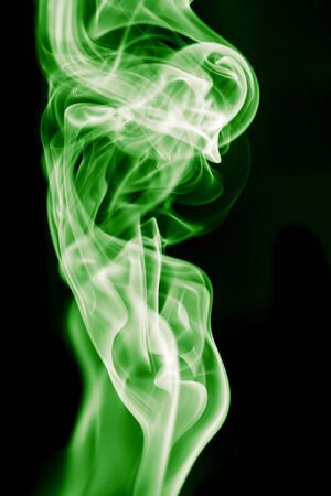 green smoke on black backgroundの写真素材