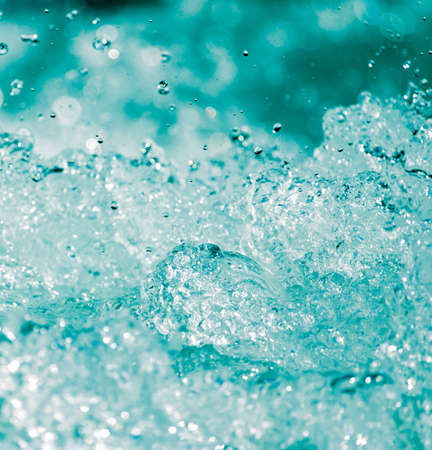 abstract background. water wave with splashesの写真素材