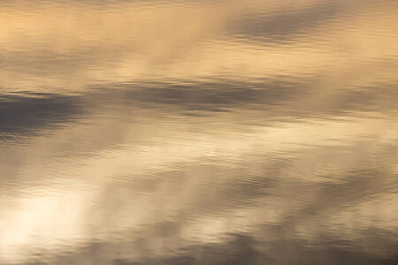Sunset reflection in waterの写真素材