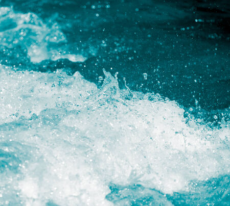 abstract background. water wave with splashesの写真素材
