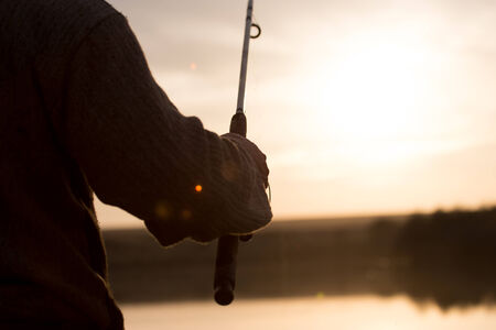 rod on the lake at sunsetの写真素材