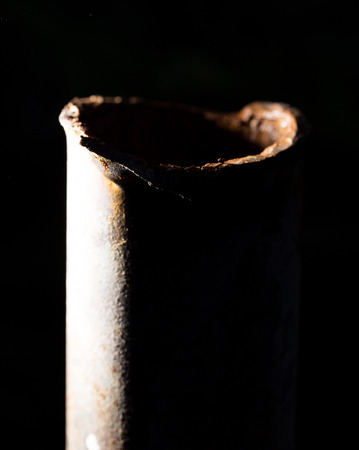 rusty pipe on black backgroundの写真素材