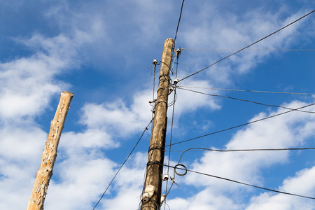 electric pole on the background of blue skyの写真素材
