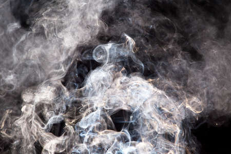 abstract background. smoke on black backgroundの写真素材