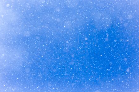 snowing on a blue sky