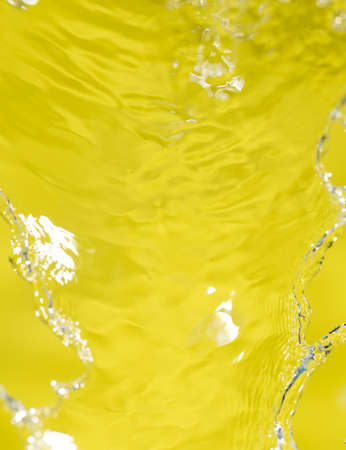 water on a yellow backgroundの写真素材