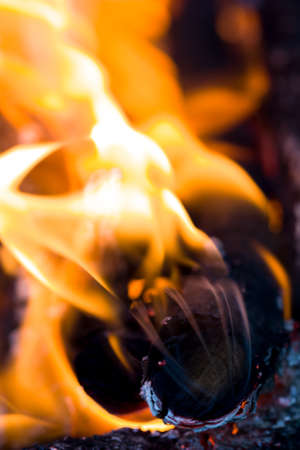 flames of fire from charcoal as backgroundの写真素材