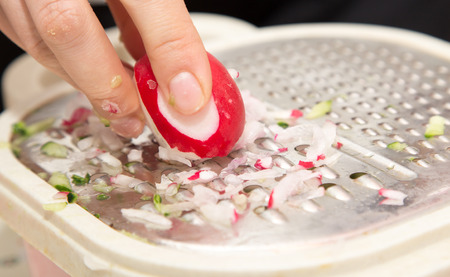 sliced radishes on a grater