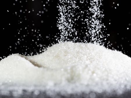 sugar on a black backgroundの写真素材