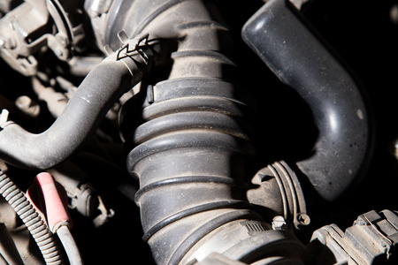 old parts under the hood of a carの写真素材