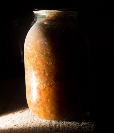 Old bank with jam in the basement in the darkの写真素材