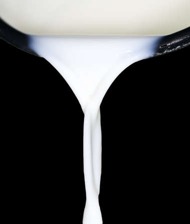 Milk on a black の写真素材