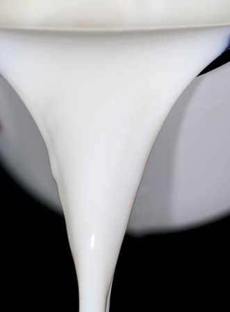 milk on a black backgroundの写真素材