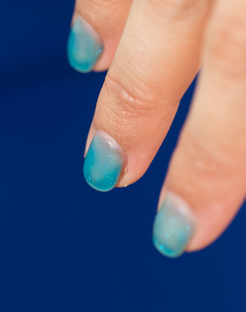 nail polish on their fingersの写真素材