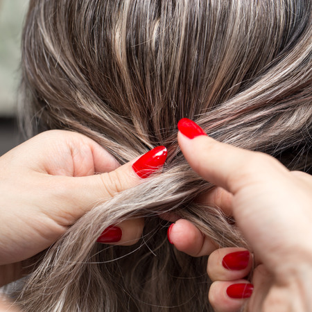 braided pigtails in the beauty salonの写真素材