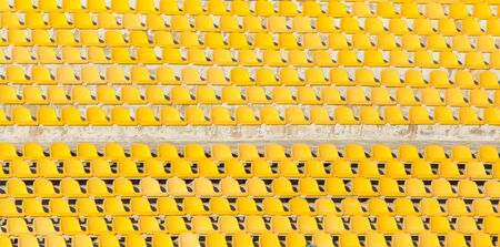 Yellow seats on the podiumの写真素材