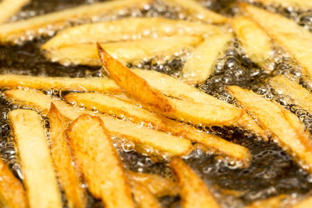 French fries fried in a panの写真素材
