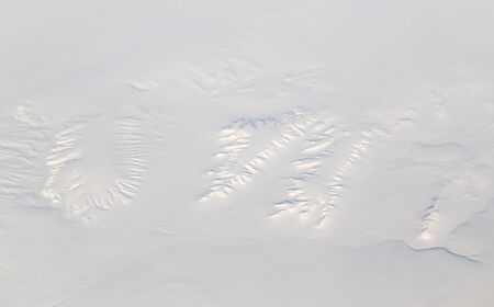 snowy land. view from the airplane
