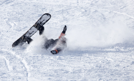 snowboarder fell in the snowの写真素材