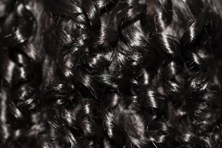 black curly hair as backgroundの写真素材
