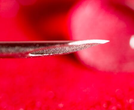 syringe needle on a red background. closeの写真素材