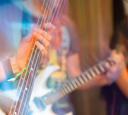 aggressive play guitar on stageの写真素材