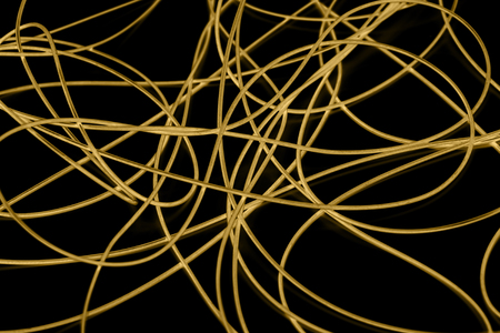 yellow cable on the black background. The inversionの写真素材