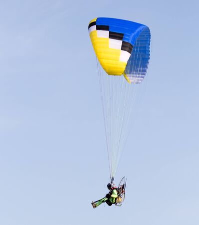parachute flying in the skyの写真素材