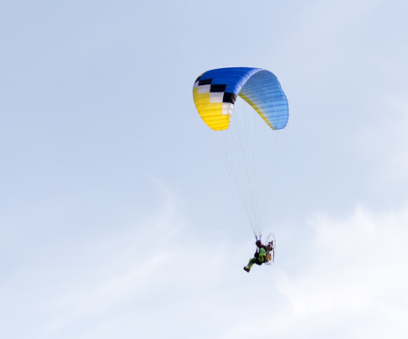 parachute flying in the skyの写真素材