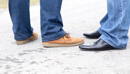 male legs in jeans and shoes
