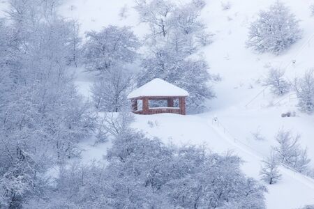 house in the mountains in winterの写真素材