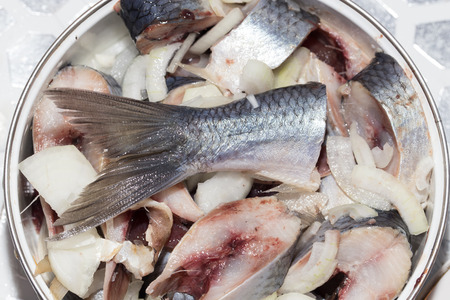 sliced herring with onions in a dishの写真素材