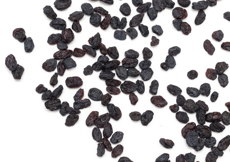 Black raisins on a white background. macroの写真素材