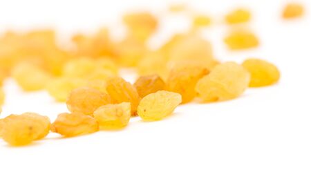 Golden raisins on a white backgroundの写真素材