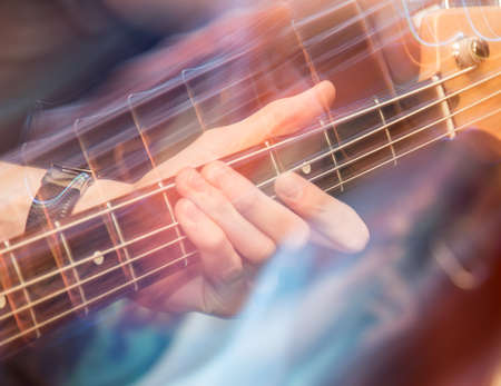 aggressive play guitar on stage