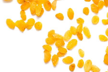 Golden raisins on a white backgroundの写真素材