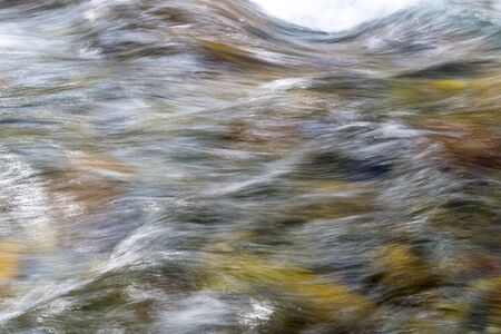 rough water in the mountain river water as a background