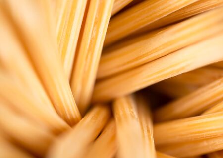 toothpicks on a blue background. macro